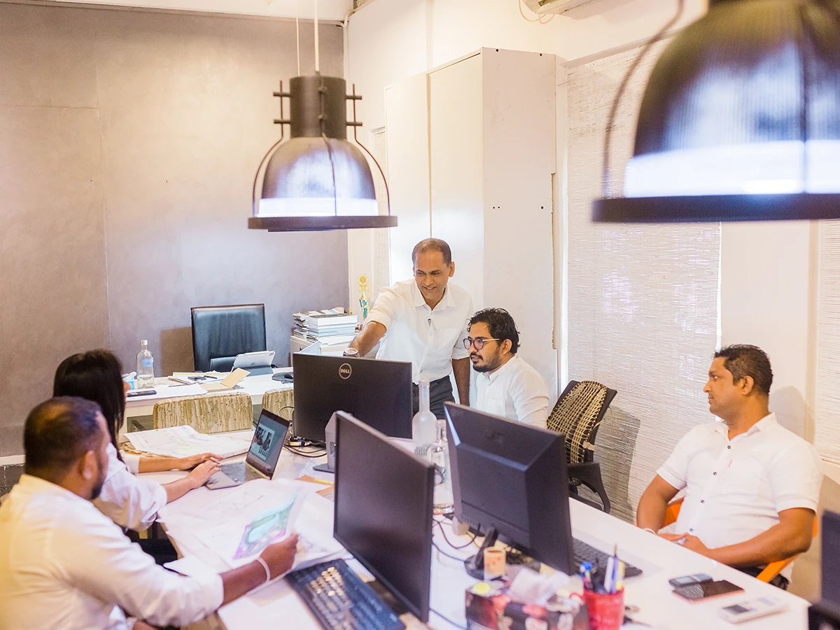 The team at work at their desks in the studio