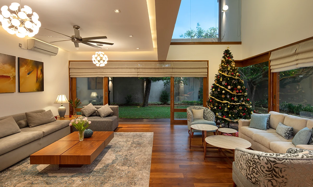 Living room opening through tall glazed doors to the back garden