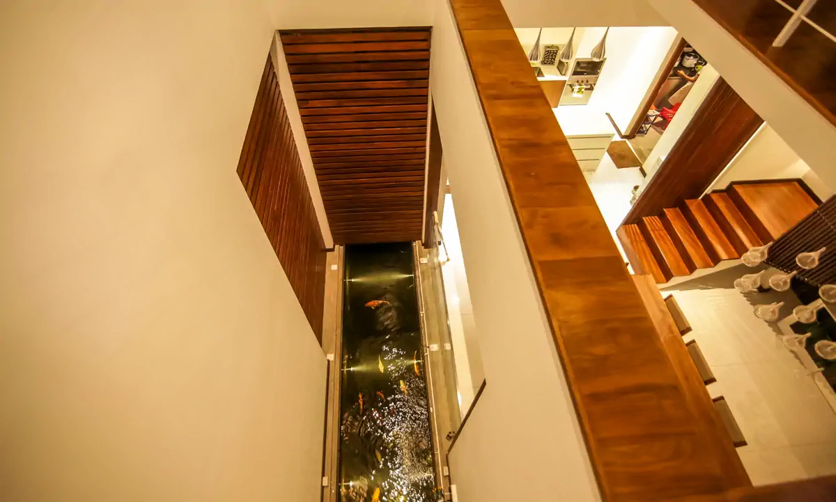 Looking down the stair void to the narrow water court on the ground floor