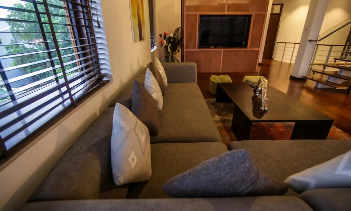 Grey corner sofa and television wall in the upstairs family room