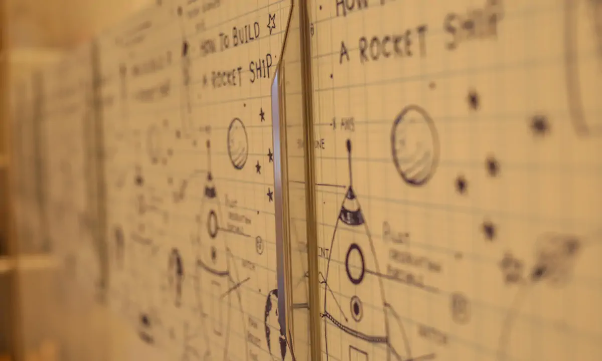 Rocket-ship sketches on a child’s bedroom wall