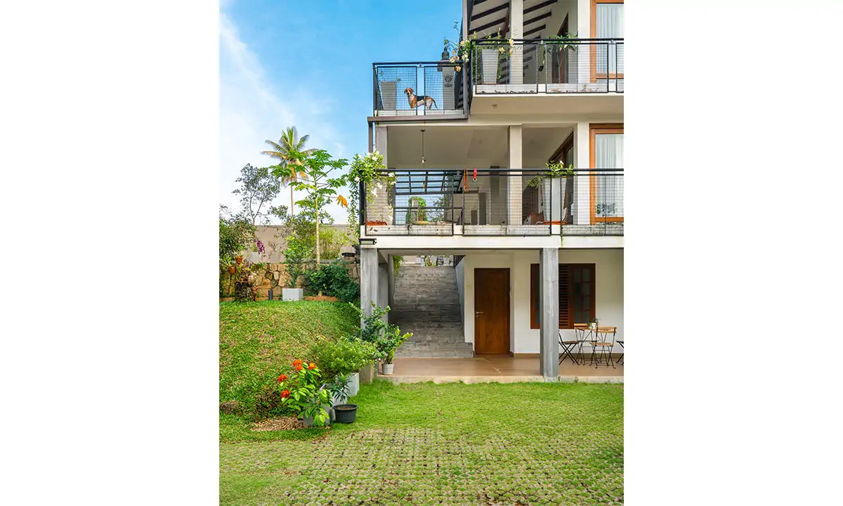 Rear of the house: three levels of balconies above the lawn