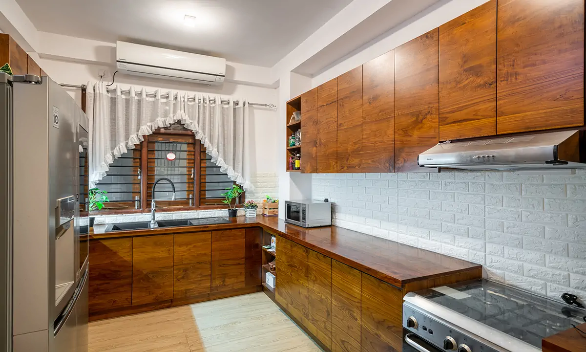 Kitchen with timber cabinets, a white tiled splashback and a window over the sink